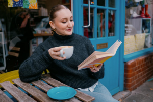 woman-enjoying-some-me-time-while-reading-a-book-and-enjoying-coffee