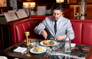 professional-having-an-evening-meal-alone-in-a-modern-restaurant.